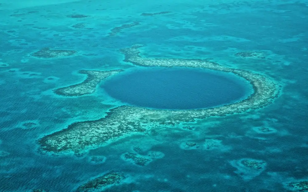 A large blue hole in the middle of the ocean
