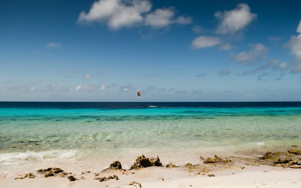 a sailboat is in the distance on a clear day